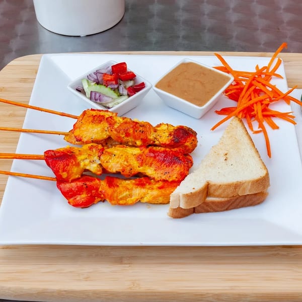 Grilled chicken satay skewers with peanut sauce